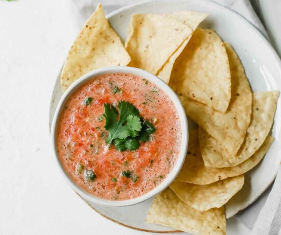 A top shot of a bowl of tomato salsa.