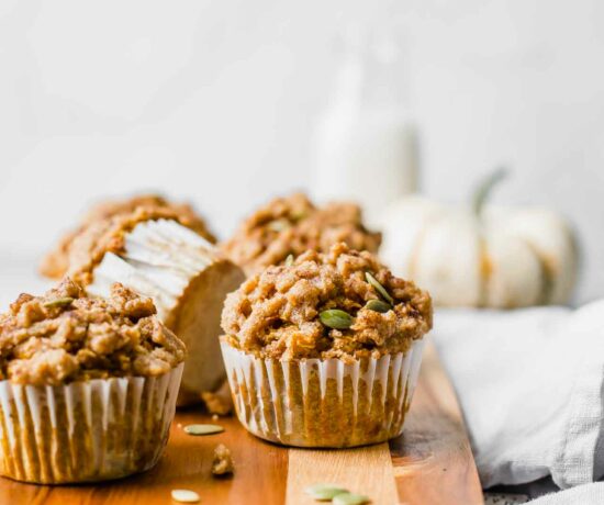 Healthy pumpkin muffins as a fall brunch idea on a cutting board.