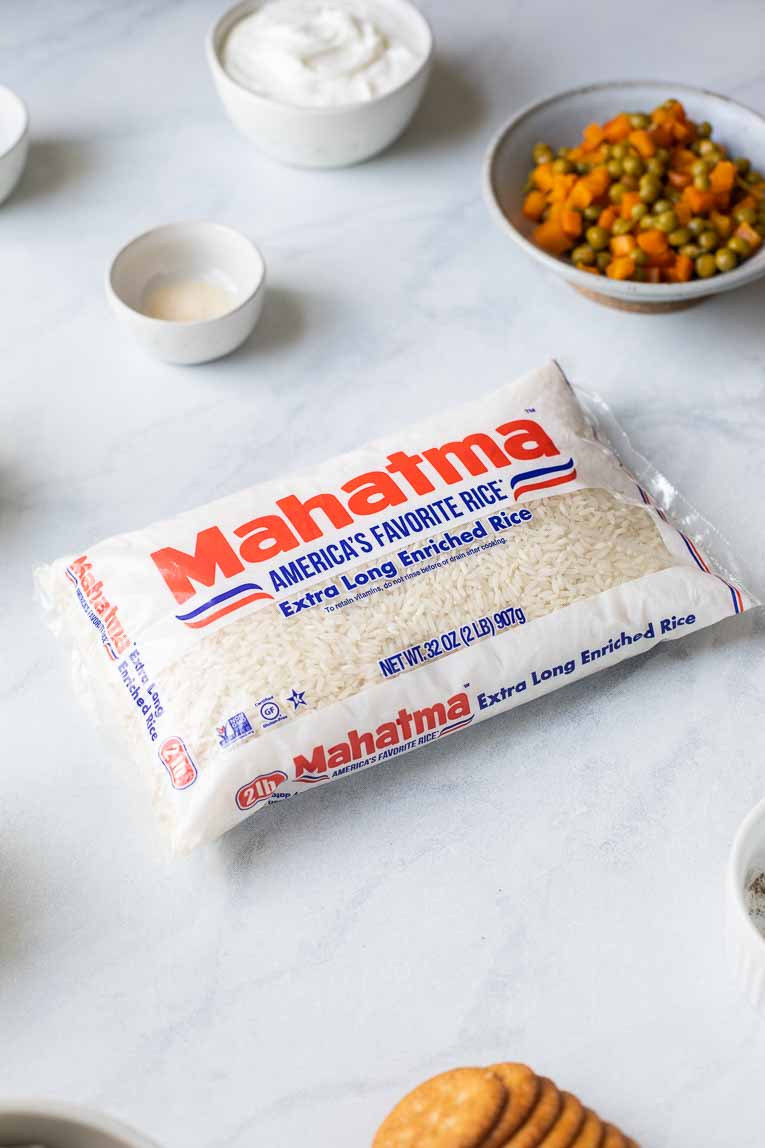 Mahatma Rice bag on a marble board with other ingredients.