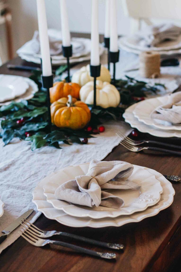 Angled shot of styled Thanksgiving table for a small gathering.