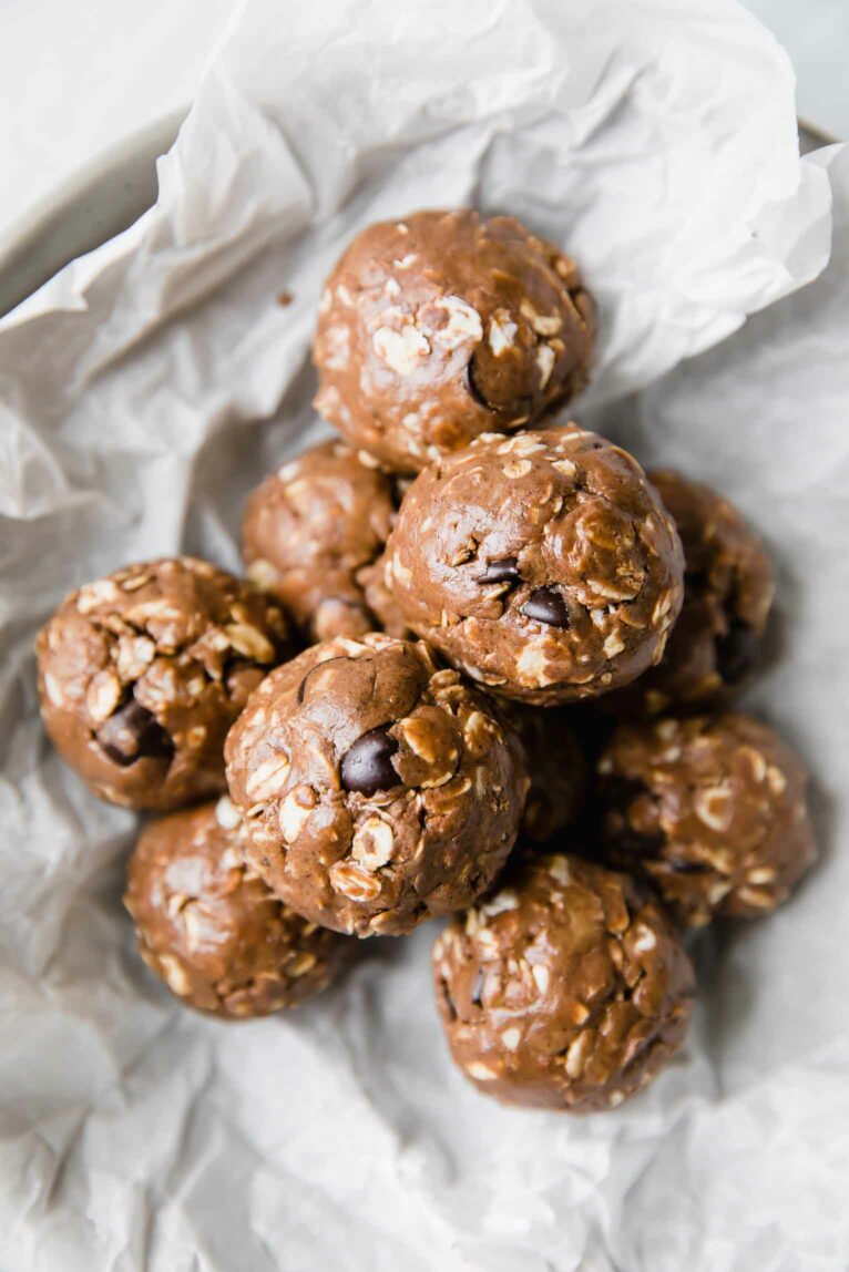 Chocolate Peanut Butter Protein Balls on a white background.