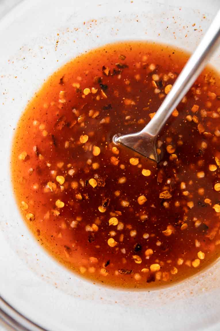 Hot honey sauce in a glass bowl.