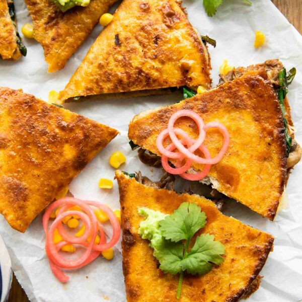 Birria Quesadillas with mushrooms, cheese, and cilantro.
