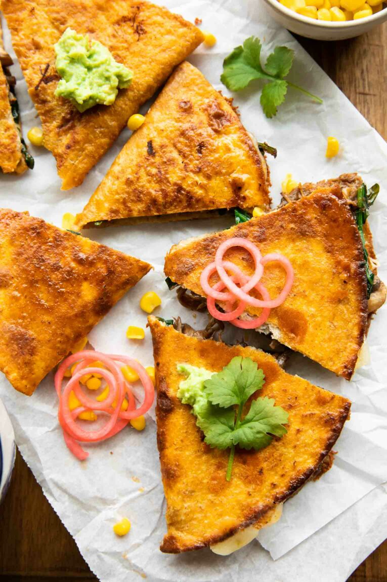 Birria Quesadillas with mushrooms, cheese, and cilantro.