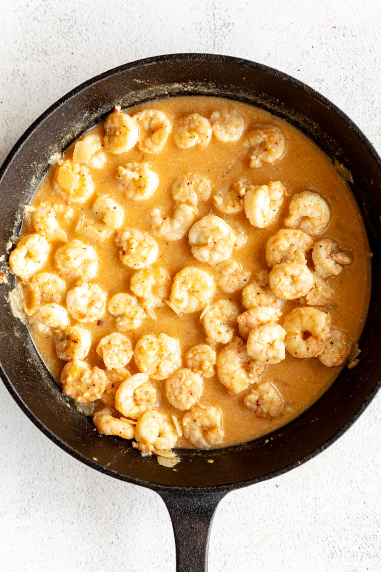 Shrimp in a skillet sauce.