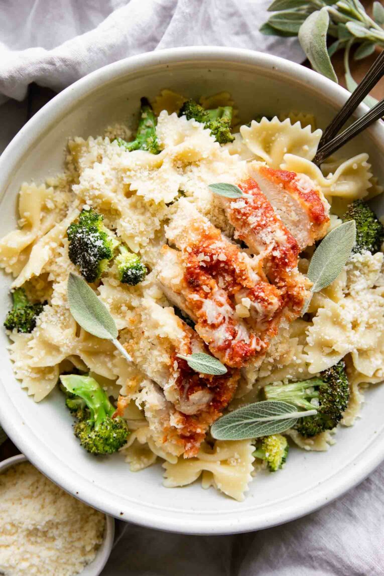 Garlic Parmesan Chicken Pasta in a bowl with forks.
