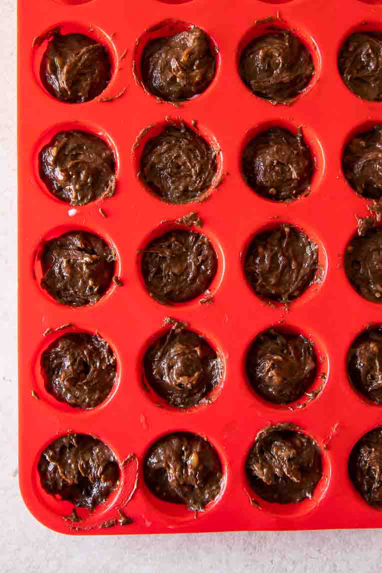 Protein brownie batter in a mini muffin pan.
