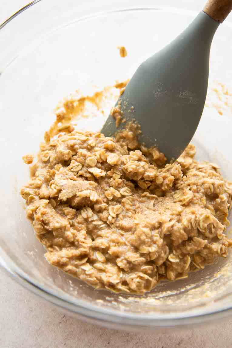 Oatmeal bar crust being mixed in a bowl.