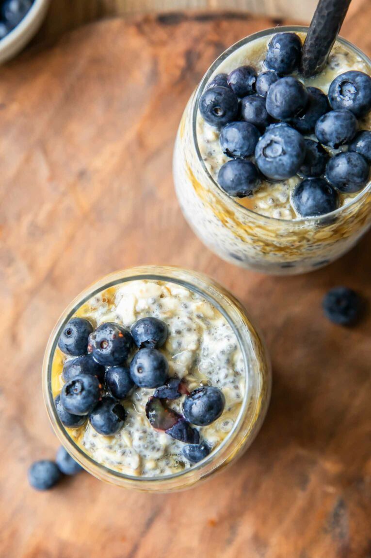 Top shot photo of Easy Blueberry Chia Overnight Oats in glass jars.
