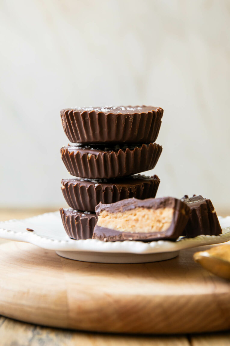 Across photo of stacked healthy peanut butter cups on a plate.