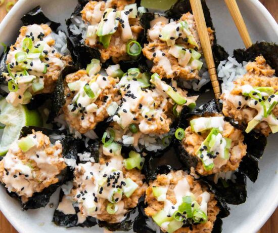 Salmon sushi cups with chopsticks.