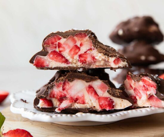 Strawberry chocolate yogurt bite cut in half.