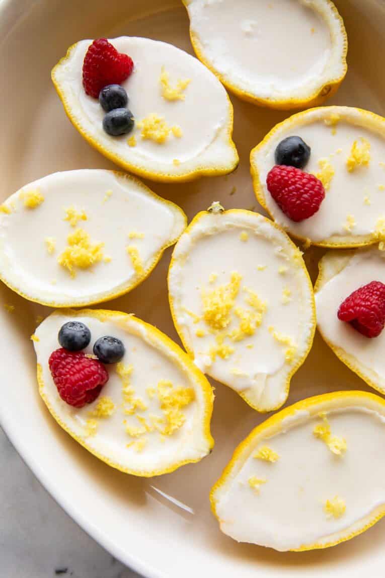 Lemon posset inside a lemon peel.