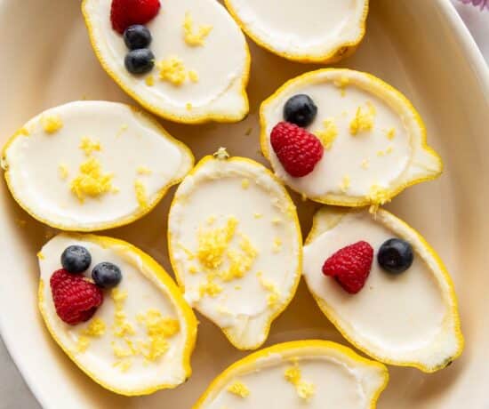 Lemon posset inside a lemon peel.