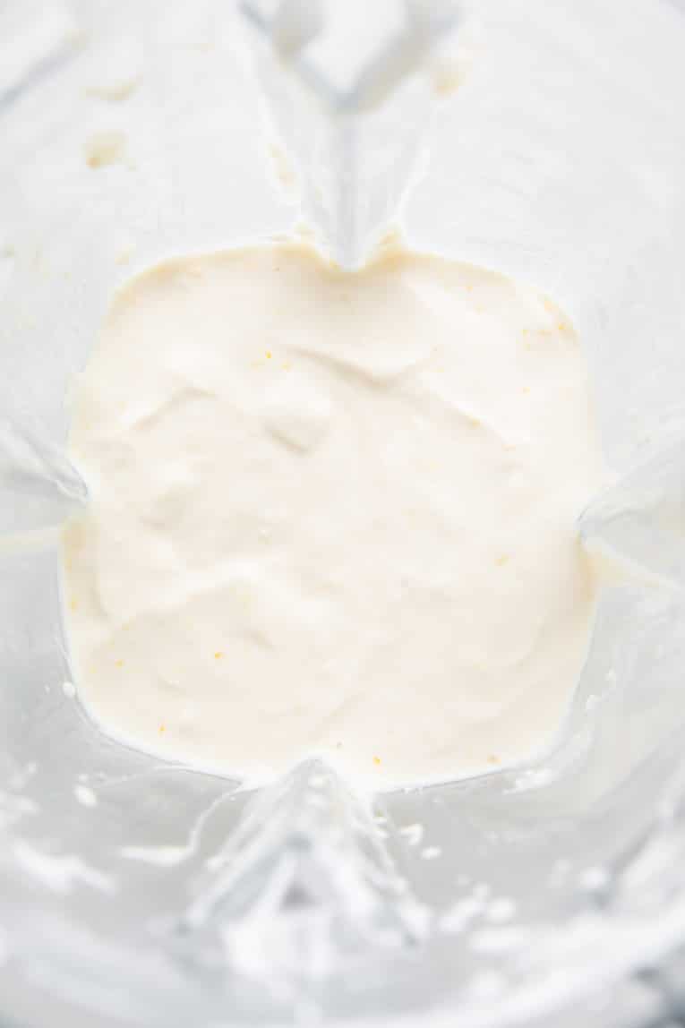 Lemon posset ingredients in a blender.