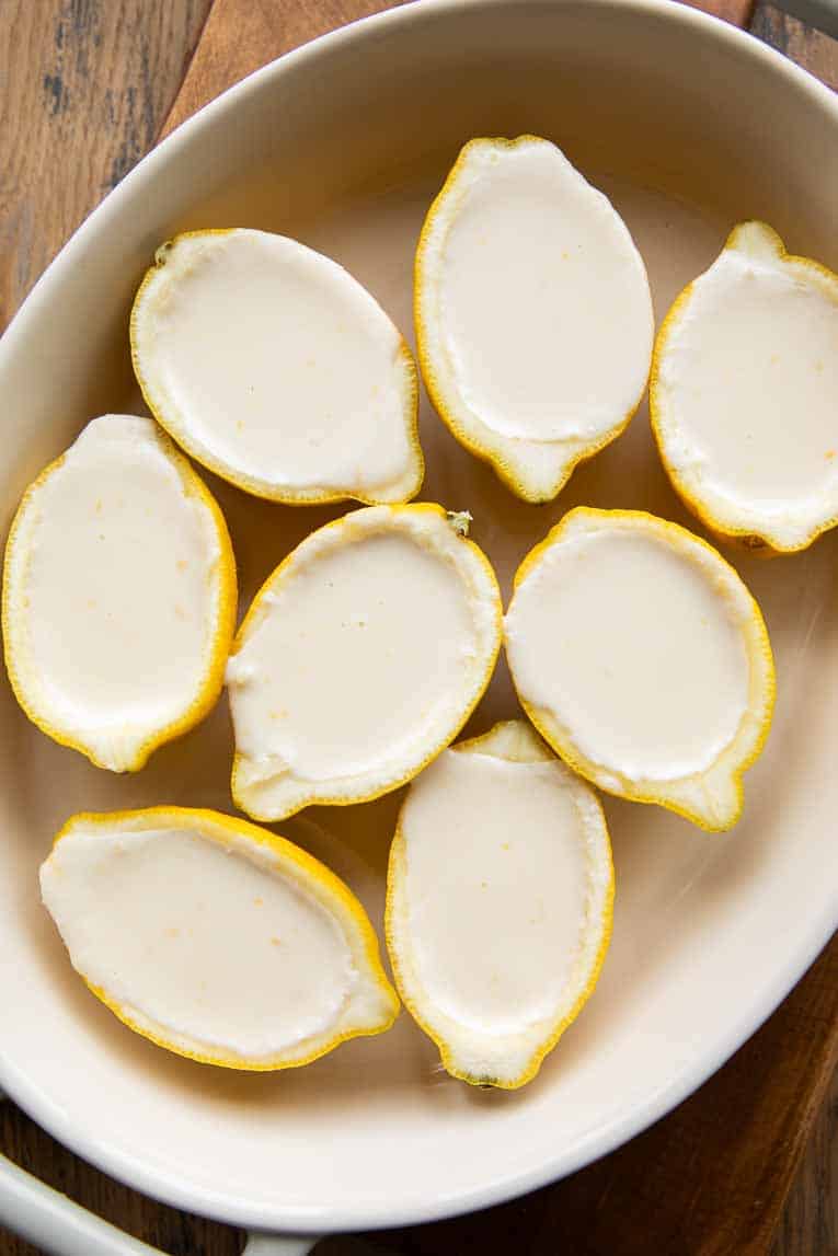 Lemon posset inside lemon halves.