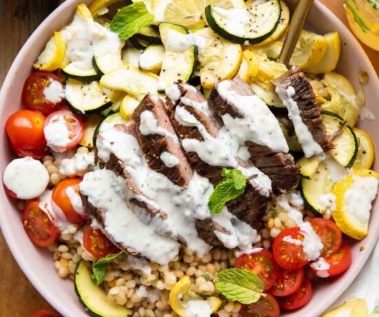 Steak Couscous Bowl on a cutting board.