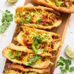 Top view of Taco Bell Chalupas on a cutting board.