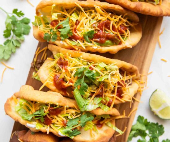 Top view of Taco Bell Chalupas on a cutting board.