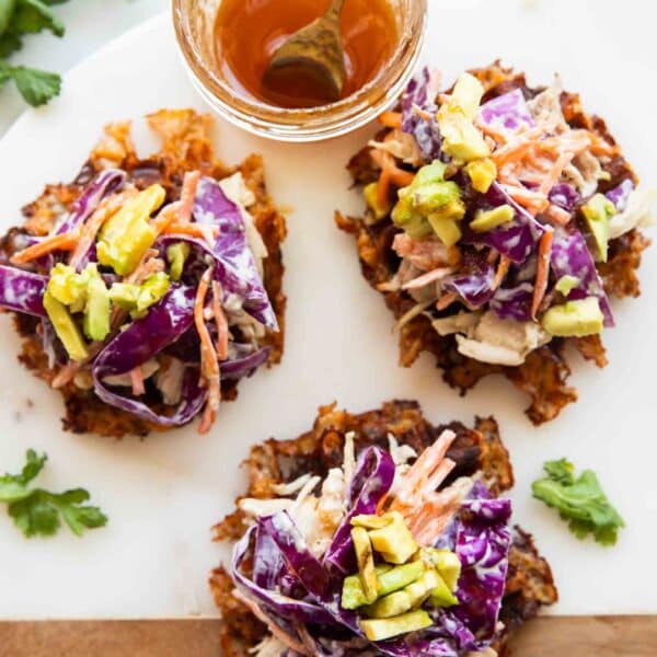 Hot honey sweet potato waffles on a cutting board.