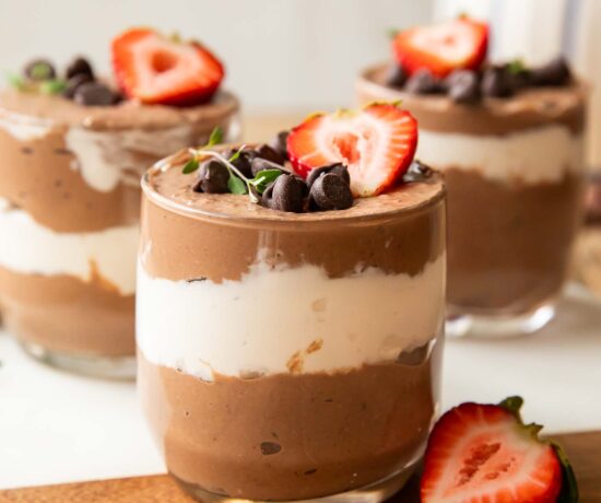 Chocolate Mousse Parfaits on a cuttings board.