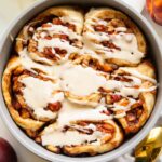 Brown Sugar Peach Cinnamon rolls in a baking pan.