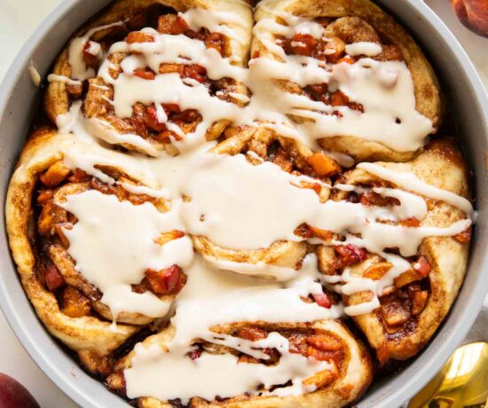 Brown Sugar Peach Cinnamon rolls in a baking pan.