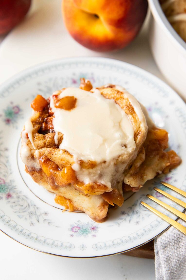 Brown Sugar Peach Cinnamon roll on a plate.