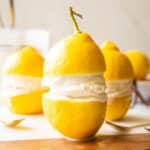 Limoncello Ice Cream in between two lemons.