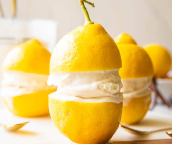 Limoncello Ice Cream in between two lemons.