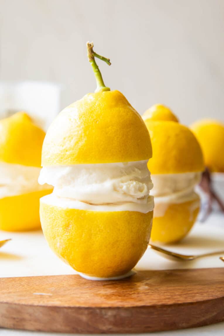 Limoncello Ice Cream in between two lemons.