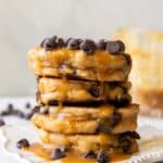 A stack of Peanut Butter Chocolate Chip Pancakes on a plate.