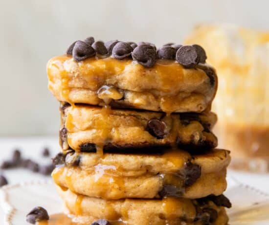 A stack of Peanut Butter Chocolate Chip Pancakes on a plate.