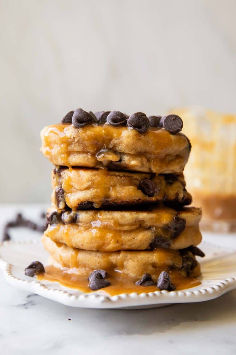 A stack of Peanut Butter Chocolate Chip Pancakes on a plate.