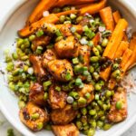 Sticky Sriracha Honey Chicken in a bowl.