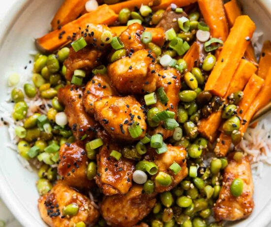 Sticky Sriracha Honey Chicken in a bowl.