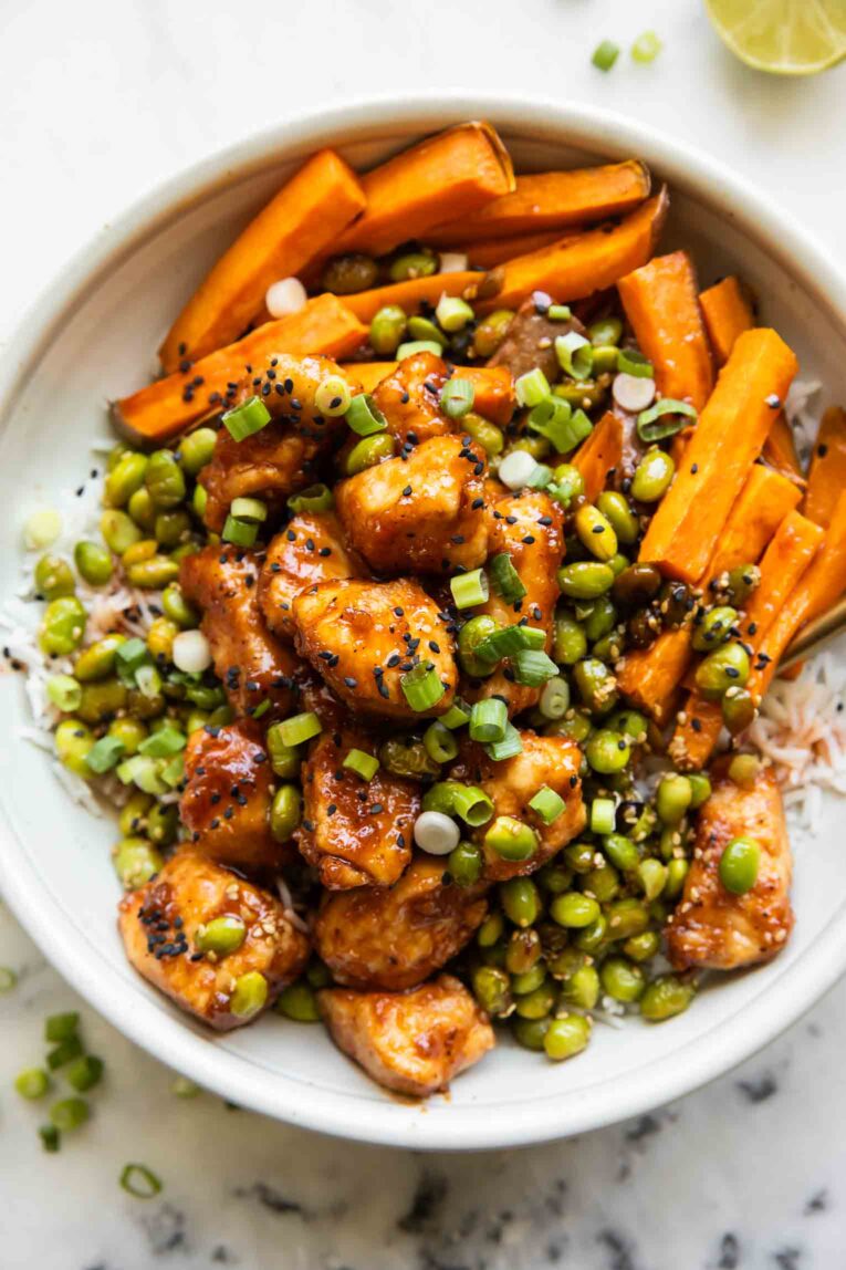 Sticky Sriracha Honey Chicken in a bowl.