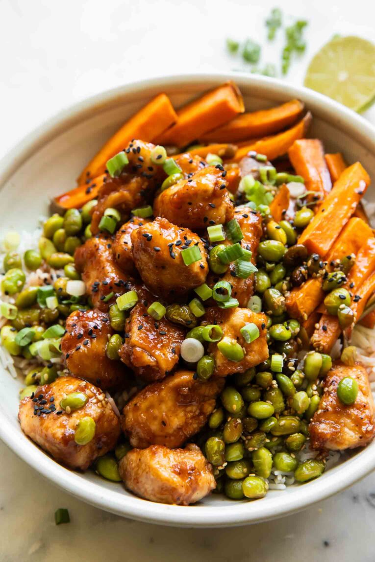 Sticky Sriracha Honey Chicken in a bowl.