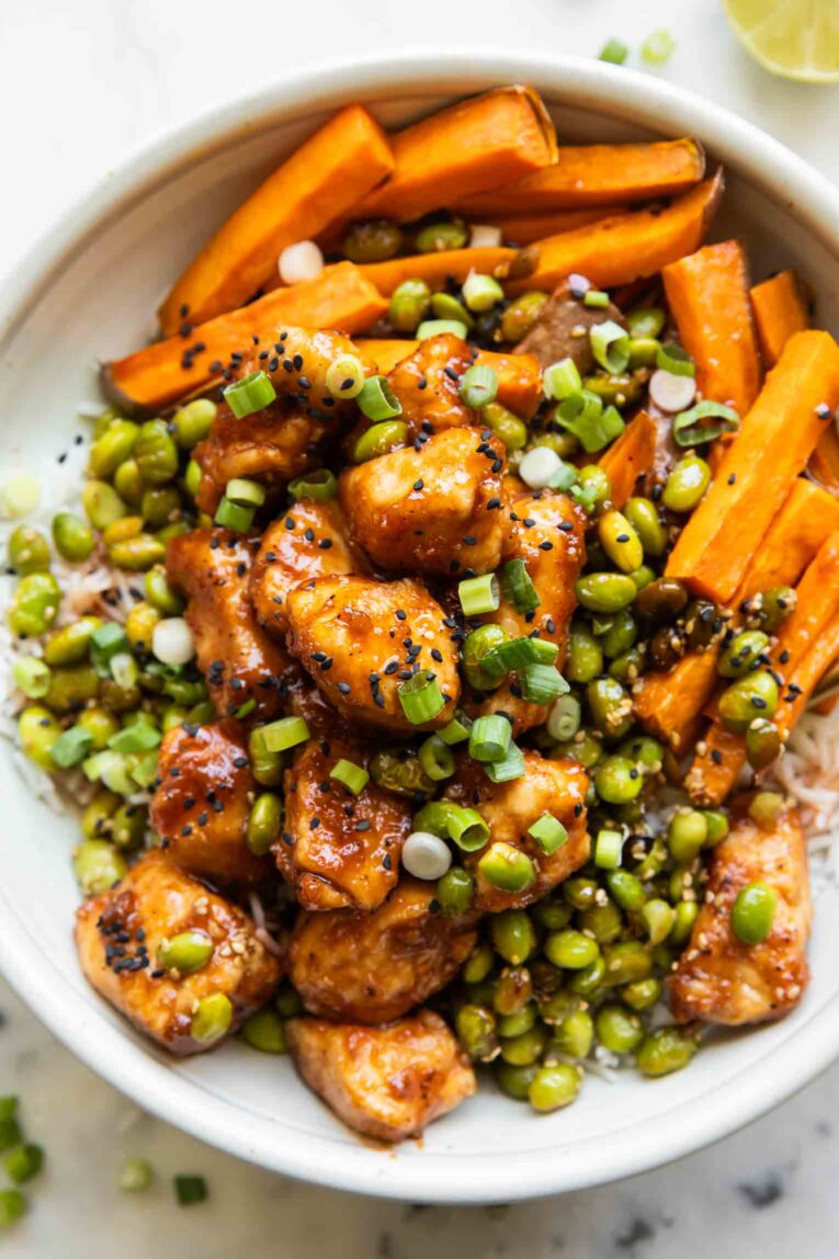 Sticky Sriracha Honey Chicken in a bowl.