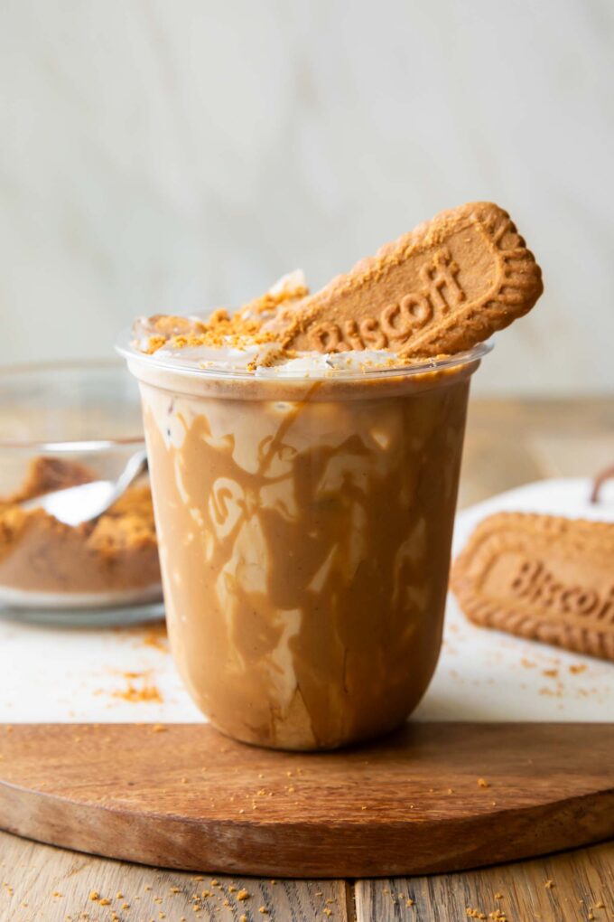 Iced Biscoff latte in a clear cup.