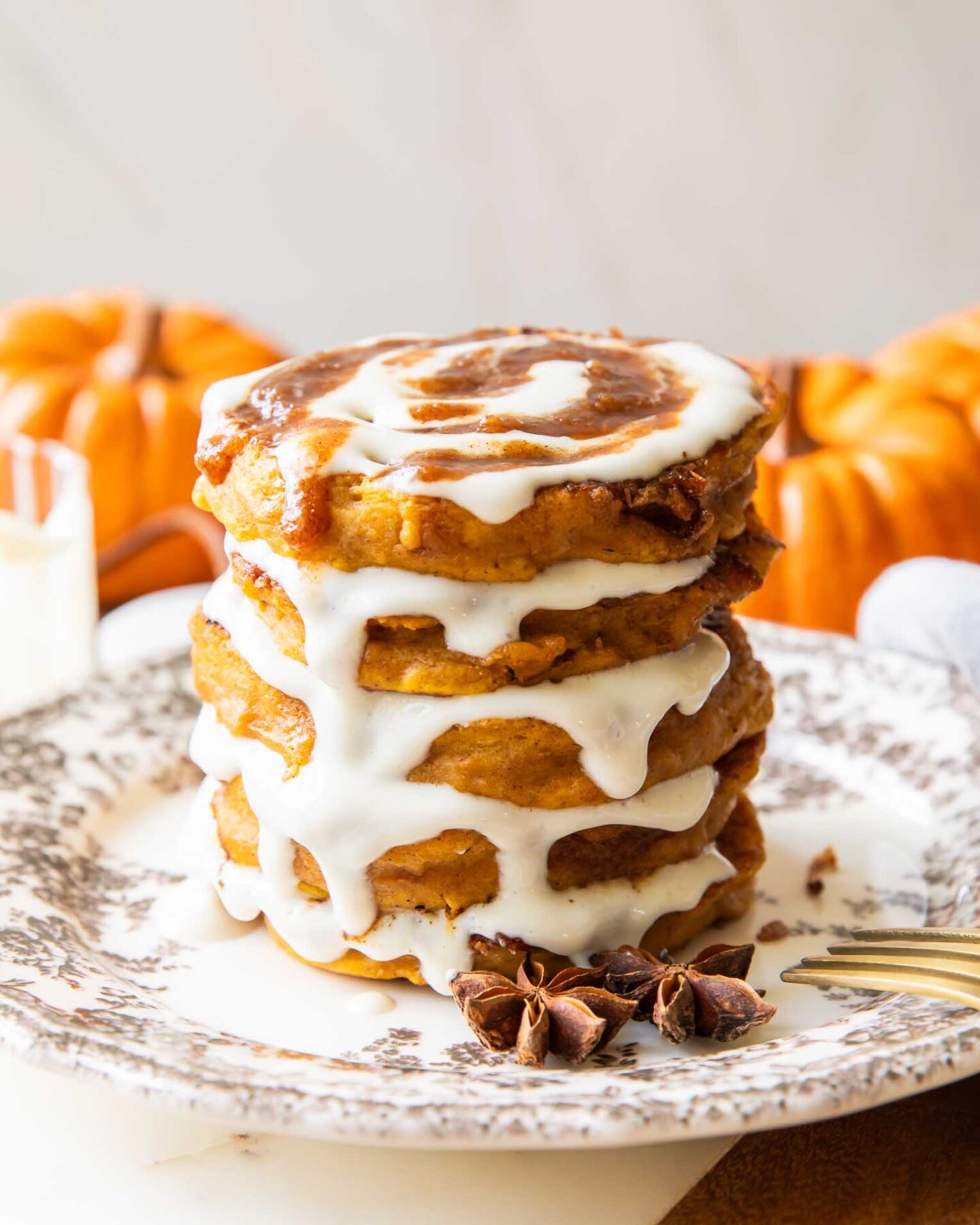 A stack of Pumpkin Cinnamon Roll Pancakes.