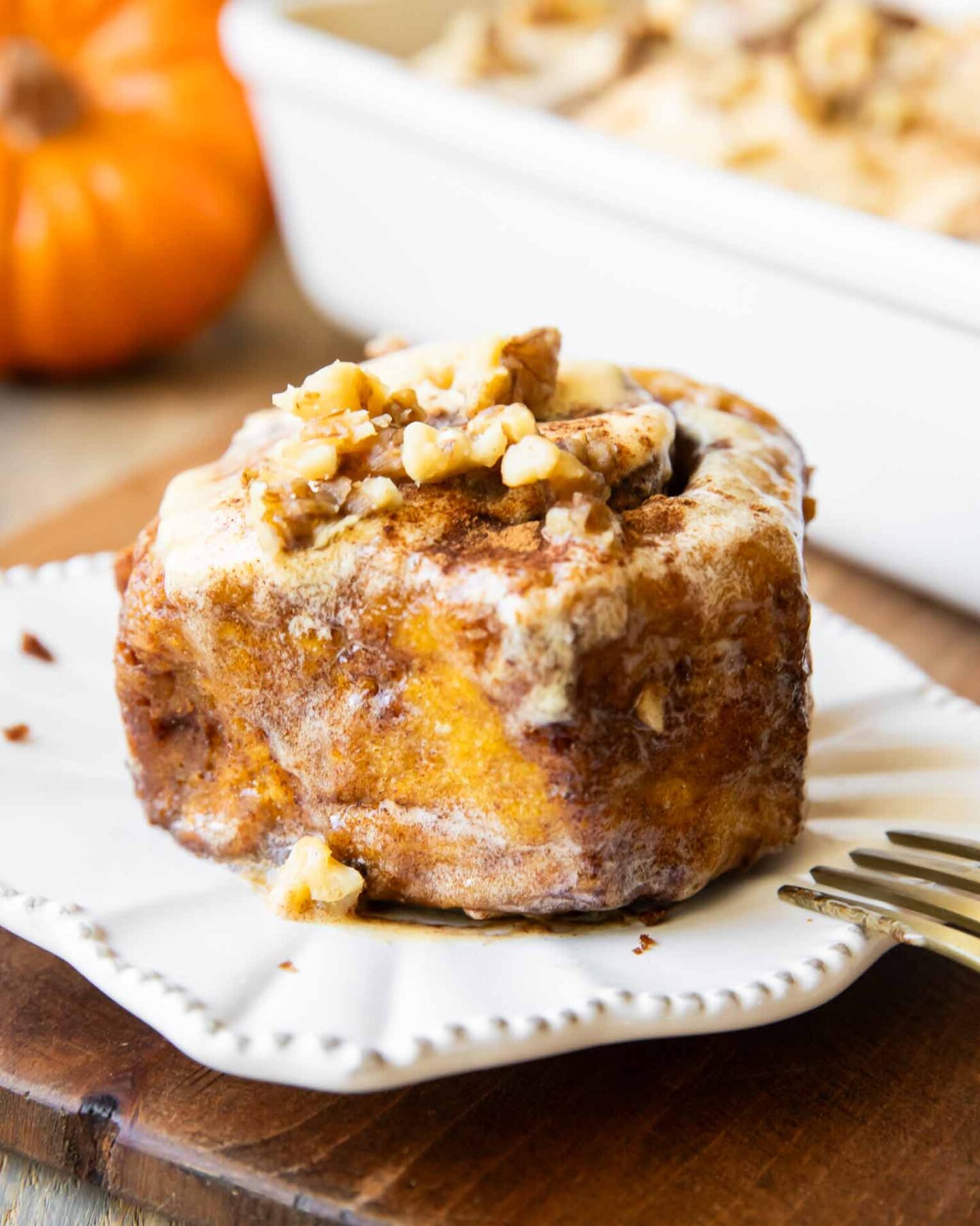 Pumpkin Cinnamon Roll on a plate.