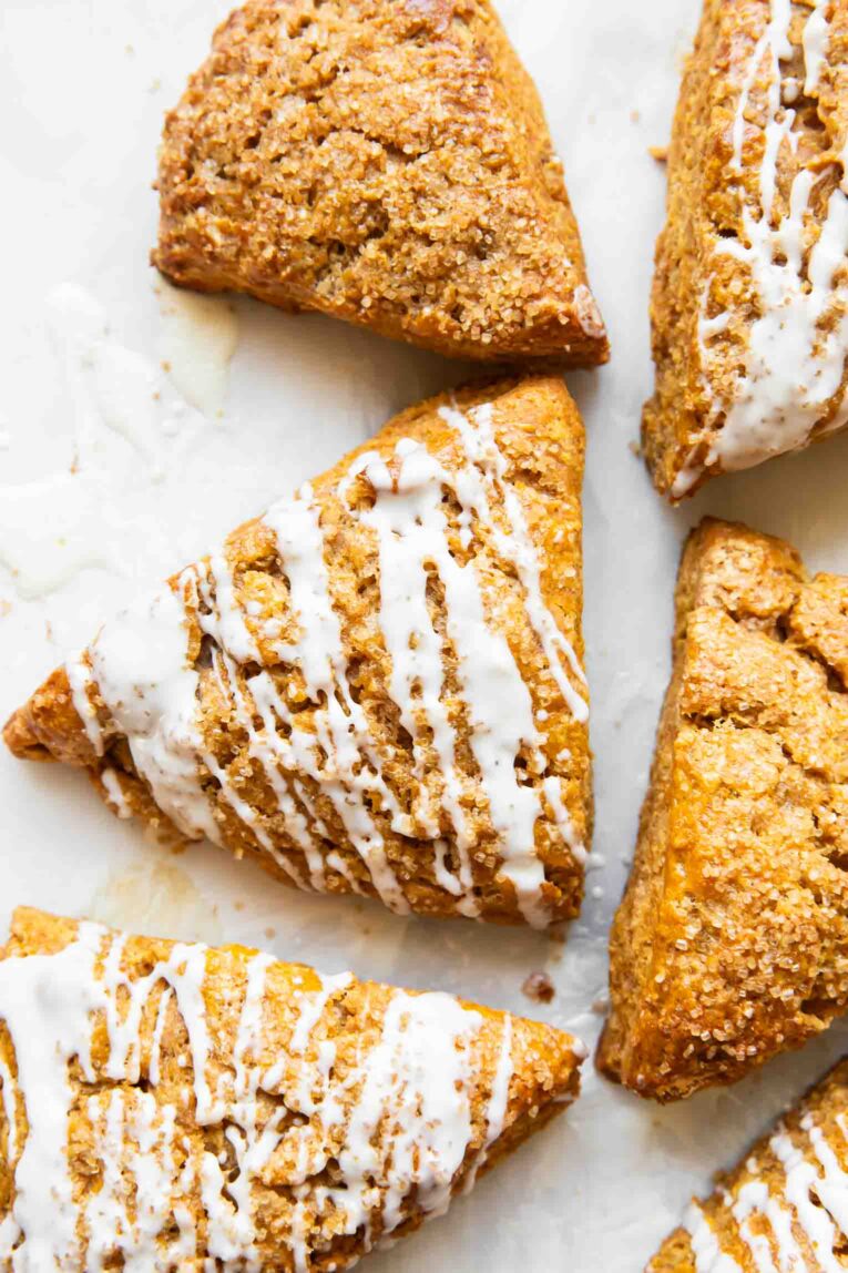 Pumpkin cottage cheese scones on a white surface.