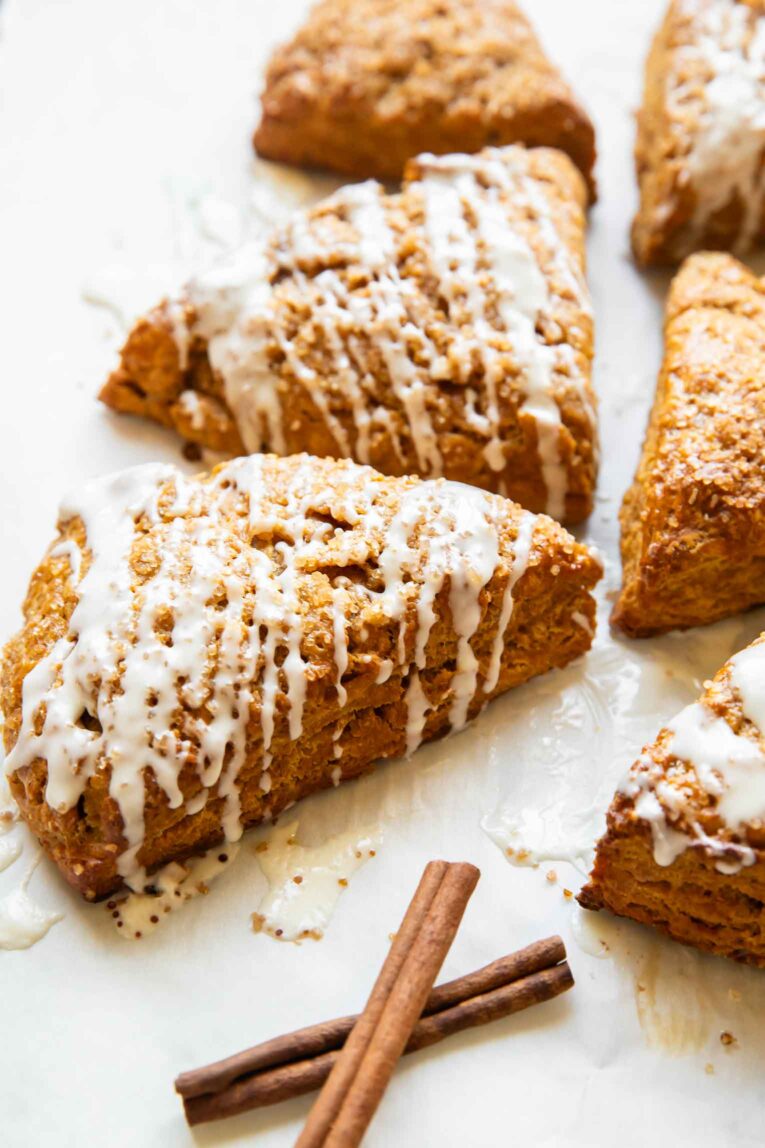 Pumpkin cottage cheese scones on a white surface.