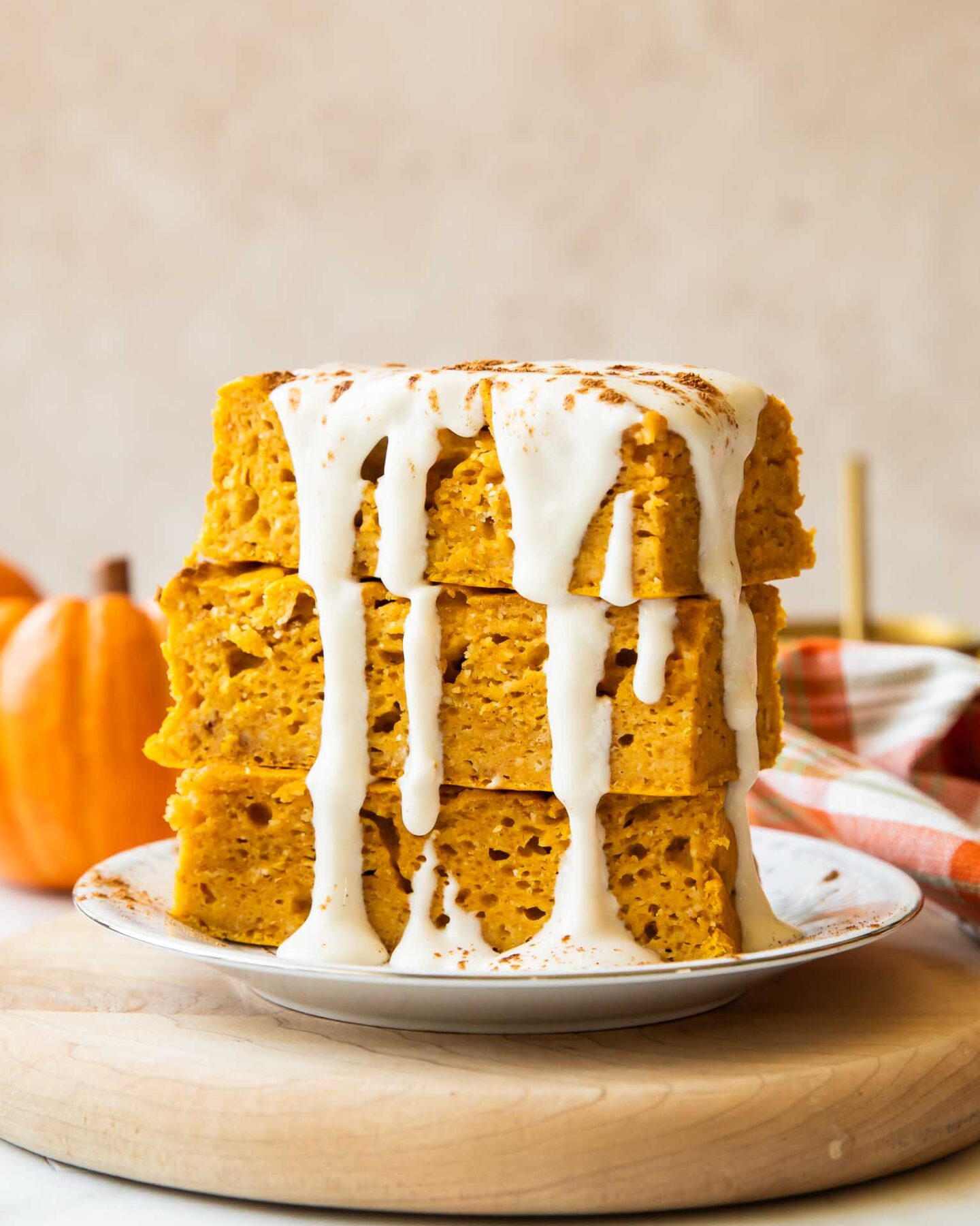 A stack of pumpkin pancake bars on a plate.