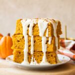 A stack of pumpkin pancake bars on a plate.