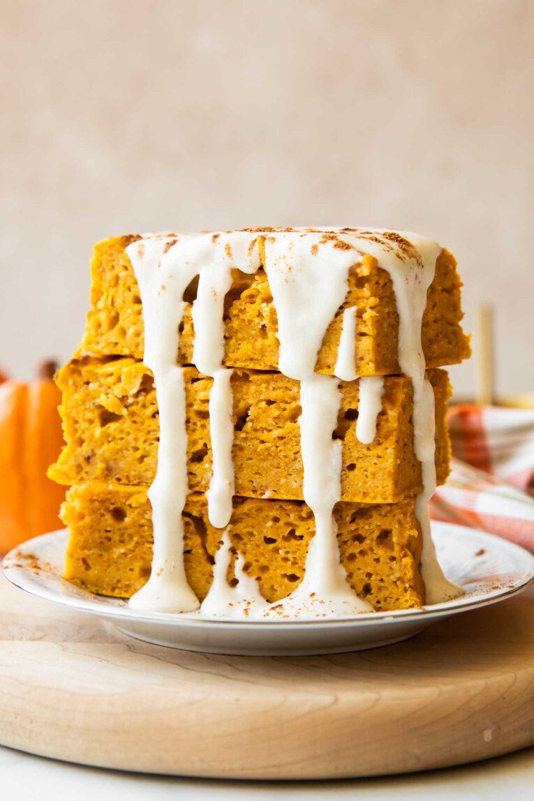 A stack of pumpkin pancake bars on a plate.
