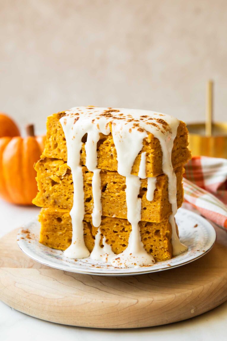 A stack of pumpkin pancake bars on a plate.