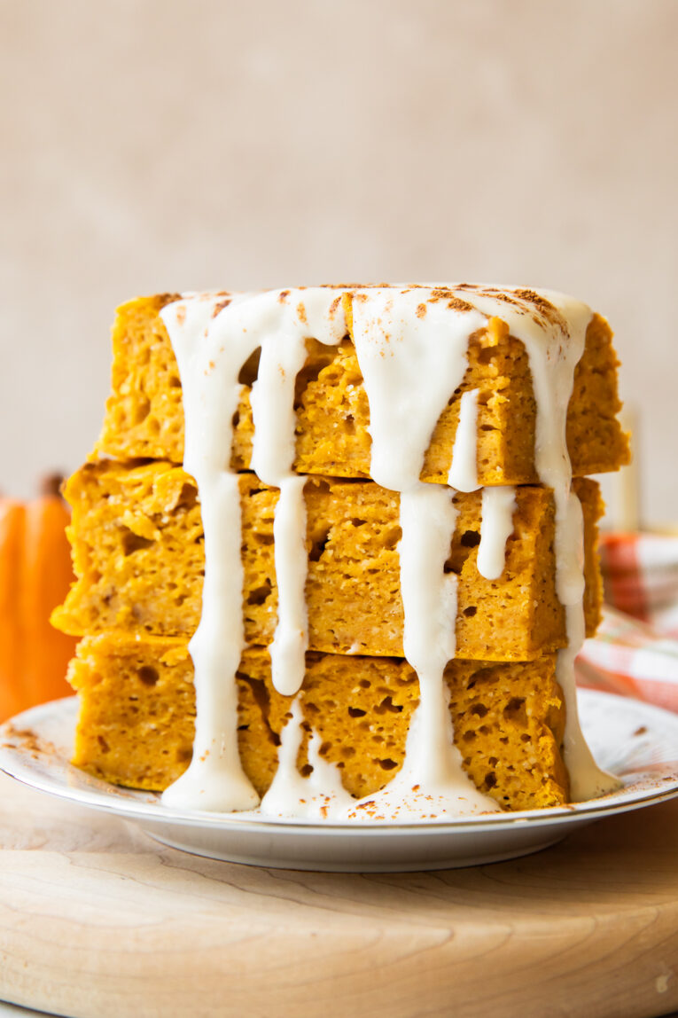 A stack of pumpkin pancake bars on a plate.